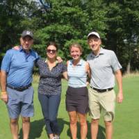 Two women and two men on gold course